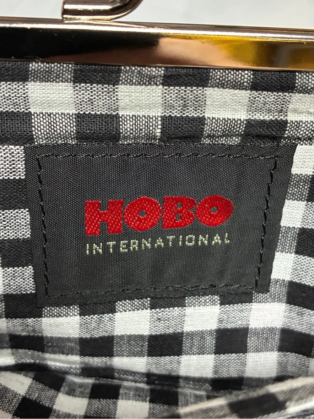 HOBO International Black Patent Finish Bow Kiss Lock Continental Wallet Clutch